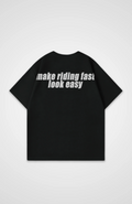 make riding fast look easy Oversized Shirt
